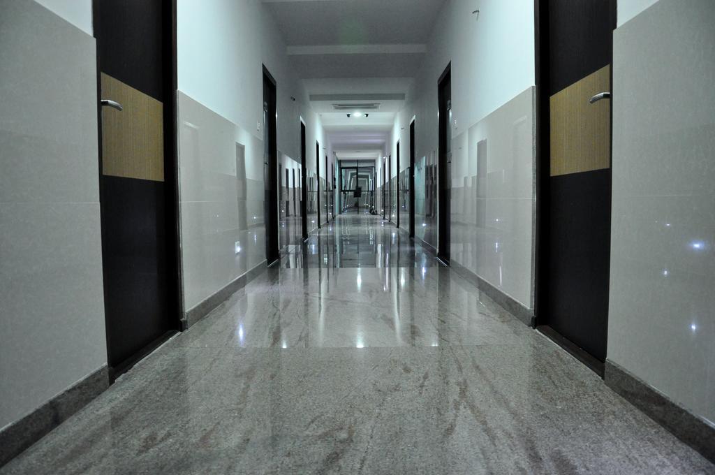 Hotel The Home Tiruppur Quarto foto